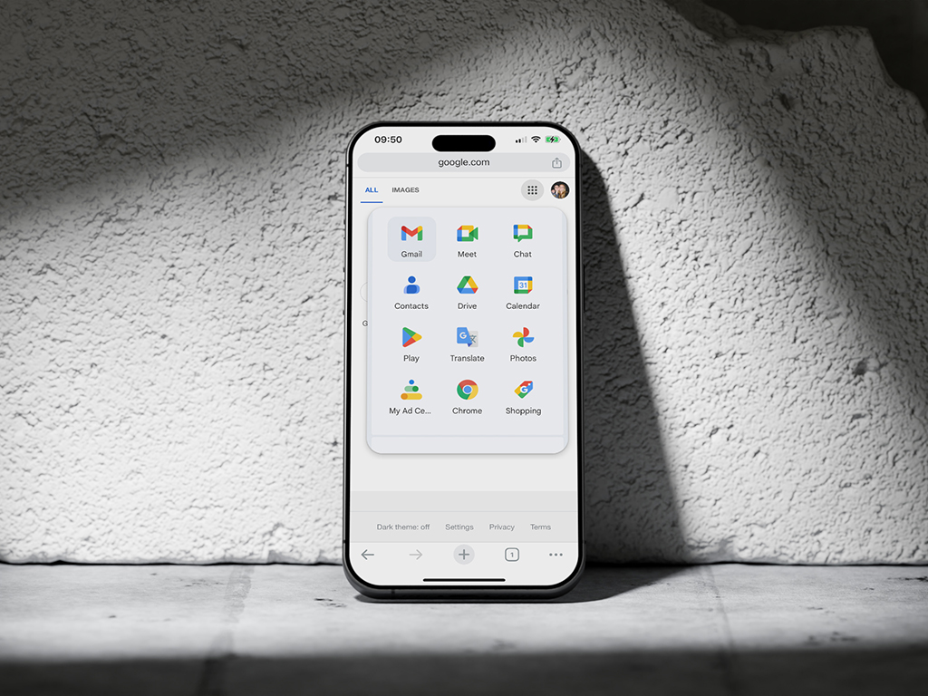 A smartphone screen displaying a grid of Google app icons. The phone is placed against a textured, light-colored surface. This image demonstrates the Gestalt principle of similarity, where objects with similar attributes (like shape or color) are perceived as part of a group