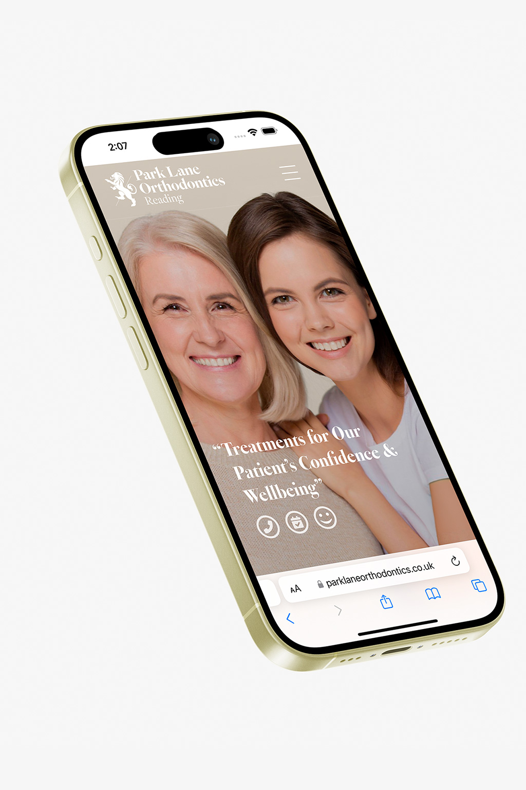 Smartphone showing a dental clinic's website with two smiling women, promoting treatments for confidence and wellbeing.