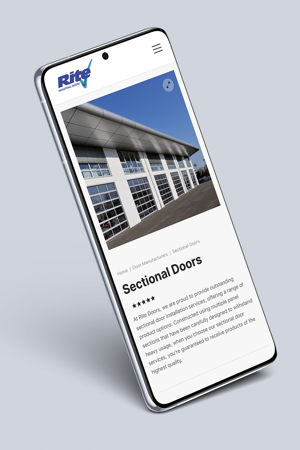 Smartphone showcasing an industrial door company's website with a photo of a modern commercial building.